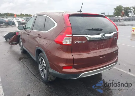 2015 Honda Cr-V Touring z USA, uszkodzony, nr VIN 5J6RM4H96FL120845